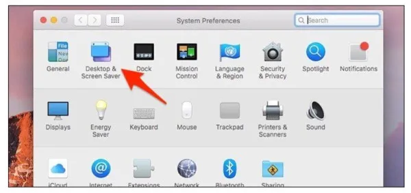 nhấn chọn Desktop & Screen Saver để thay đổi hình nền cho Macbook.